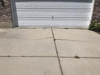 The driveway had sunken and cracked.