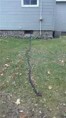 This drainage system is not very efficient. It goes through a window vent in the basement which allows more debris and moisture in. It's also not very appealing and can easily freeze in the winter which can cause more problems.