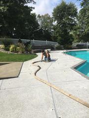 Polylevel foam being injected beneath the slab to raise and level the concrete.