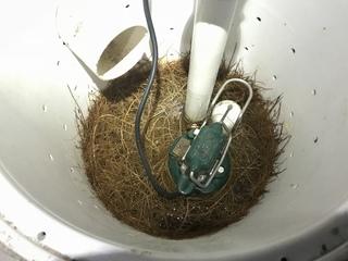 This sump pump was clogged with a root ball of grass.