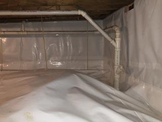 This customer had a company install a crawl space encapsulation that was uneven, bumpy, and did not solve her problems.