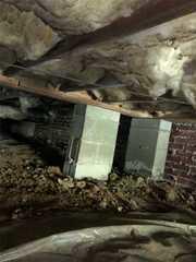 The ceiling in this crawlspace was mostly supported by concrete blocks. The concrete columns are fine, but they eventually settle into the soil. This, of course, changes the overall level of the home as the columns sink.