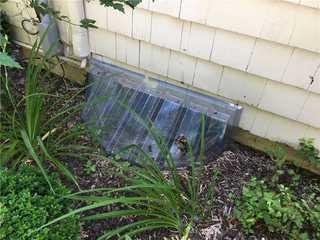 After cleaning out the debris and adding a SunHouse window well on the outside of the basement window, the design now allows more sunlight to be gathered into the basement along with disallowing any debris inside the well.