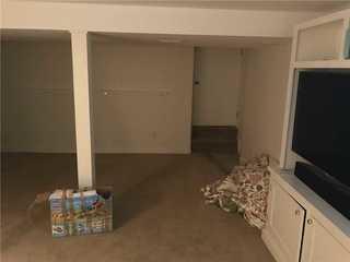 This is what the main part of the basement looked like in the middle of our production. Our Everlast walls had been put up but flooring had not yet been implemented, and neither was the lighting system we implemented.