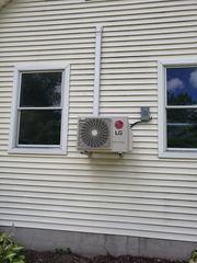 Single-zone LG outdoor unit mounted to the customer's home.