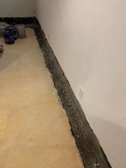 This photo shows the crew preparing the area for the Waterguard. This system sits just above the footer of the home