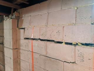 Horizontal cracks in block walls are an early indicator of bowing walls.