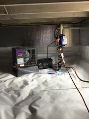 If your crawl space tends to pool with water, it's essential to install a quality sump pump system. Our SmartSump sump pump system is more than capable of discharging all the groundwater. Also seen is the SaniDry Sedona dehumidifier. It is a high-performance, energy-efficient dehumidifier that operates automatically.