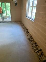 Our Foreman Charlie Evans and his crew began work by prepping the perimeter of the basement for the system.