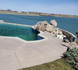 The uneven slabs around the pool had become a major tripping hazard.