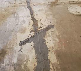 To successfully seal a concrete crack on a slab, we have to make some non-parallel cuts on the crack to add some carbon fiber laminates.