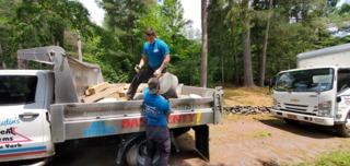 Once all the demolition work was completed for our pre-cast footings we then started to unload them from the dump truck and lowered them into the crawl space.