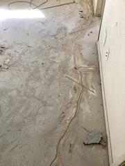 Slots are saw cut into the existing cracks.