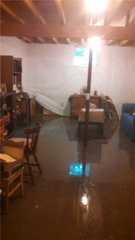 Flooding is caused by the non-working sump pump and poor drainage.