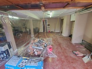 How the garage looked after demoing the area we would be installing our system.