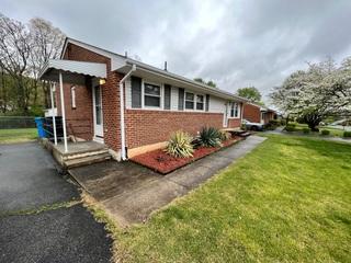 The sidewalk has sunken down and caused their front and side entryway's to lift up.