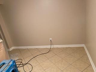 Current state of a basement that has taken water on during heavy rains.