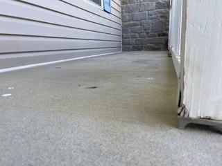 Concrete porch after being injected with PolyLevel foam.