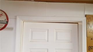 The settling foundation is causing some problems for this doorway.