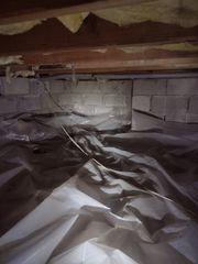 Here you can see the old plastic in the crawlspace as well as no insulation