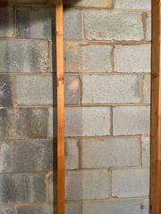 Pictured here is a 'staircase crack', named after its appearance. This is a sign of foundational shifting and can be very problematic if left untreated. Water has seeped through these cracks causing even more damage to the wall.