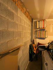 Here you can see some little bits of water damage starting on this unsealed and protected basement wall.