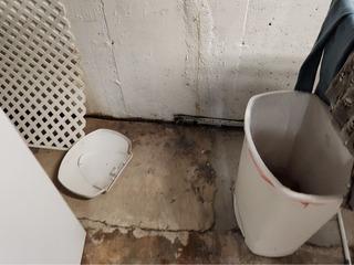 Water has been leaking in this basement, causing damage.