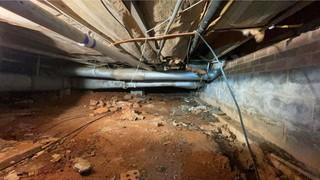 This crawl space was humid, musty, and had fallen insulation throughout the area. You can even see the water damage on the walls!