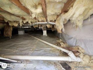 This crawl space was littered with fallen fiberglass insulation throughout - yikes!