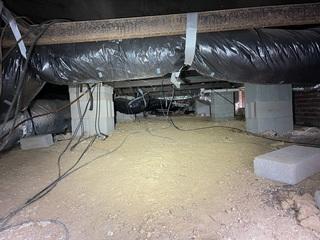 This crawl space was damp, and without a vapor barrier - completely exposed to the elements.