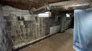This basement was suffering from severe water damage, high moisture content, and musty smells.