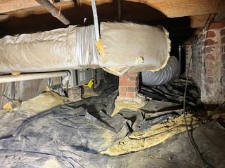 This crawl space was filled with mold and debris before our Production Crew got to it!