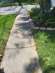 This homeowner wanted the voids filled under his sidewalk as well as having it releveled and sealed for added protection.