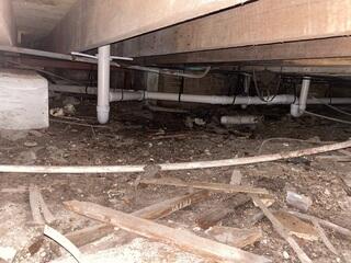 The crawlspace under this home suffered from years of wear and tear, causing settlement and sinking to the interior floors.