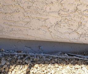 The flaking paint symptom on a failing stem wall can be perplexing, as many attribute it to sunlight and age, leading them to opt for repainting instead of addressing the underlying issue. However, the root cause of the problem should be tackled to ensure proper resolution.