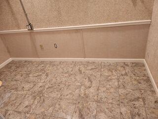 These lower wall panels, called 'Everlast Wall Panels', cover where the wall was cut to install WaterGuard. They are installed as a finishing touch to make any basement beautiful. The Thermal Dry Floor Tiles are waterproof and durable!