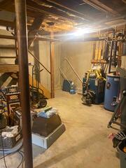 This basement had unfinished concrete floors and walls. Their staircase was also completely open.