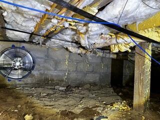 This crawlspace suffered from mold and mildew because excess moisture could not be removed quick enough under the home.