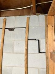 Large cracks were not the only tell-tale sign of a problem at this home. The massive storm waters eroded much of the yard away causing settlement and sinking at various points throughout the home.
