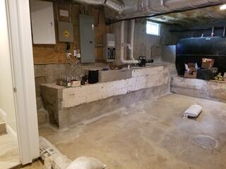 This is the basement with water damage. They were using sandbags to protect the basement from water.