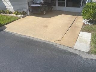 Due to soil erosion underneath, the right side of the homeowner's driveway had settled.