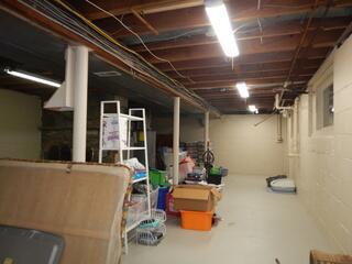 This is the basement before any finishing. It is in need of an upgrade!