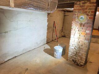 These wall cracks are a result of a bowing wall.