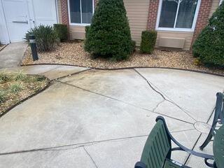 Soil settlement has affected the concrete courtyard at the healthcare center, resulting in an uneven surface and the emergence of dangerous trip hazards, as well as numerous cracks throughout the slabs.