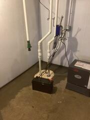 Frank's installed interior drainage leading to a Super Sump Plus system, BrightWall, and a Sanidry Sedona into this homeowner's basement. This homeowner's floor will never be wet again!