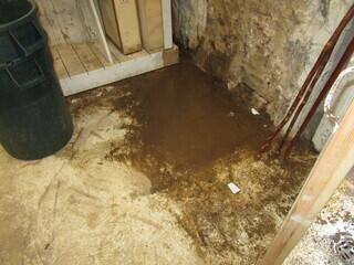 This homeowner had a basement with water coming in, causing it to be a muddy mess.