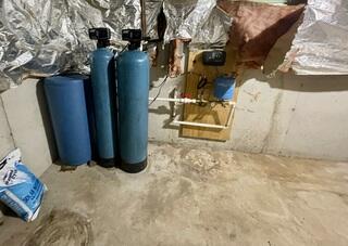 Mud on the basement floor remains after water coming in the basement has receded - a big mess!