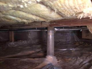 Previous attempts to encapsulate the homeowner's crawl space had proven ineffective, as the use of inferior materials and the absence of proper drainage solutions had failed to keep the area free from moisture.