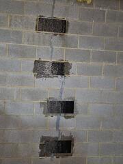 We permanently secured this wall crack using the CarbonArmor system. CarbonArmor uses fiber-reinforced polymers which are 10-times stronger than steel, but flexible enough to contour against the basement wall.