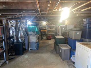 This basement had some supports, but they were not helping the sagging floors above. They needed a new, permanent solution that would solve this problem.